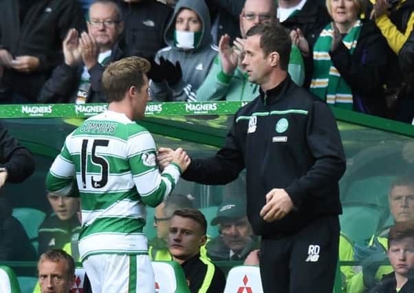 Kris Commons (left) with manager Ronny Deila as he is substituted in Celtic's 5-0 win over Dundee United. Picture: SNS
