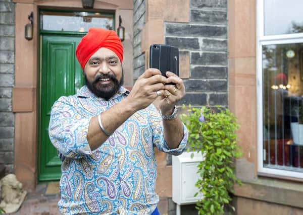Tony Singh uses Periscope to give prospective housebuyers a tour of his property. Picture: Malcolm McCurrach