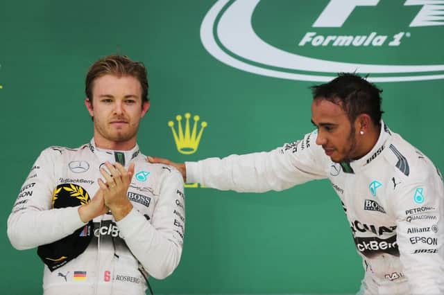 A joyous Lewis Hamilton, right, and a less-than-delighted Nico Rosberg on the podium in Austin. Picture: PA