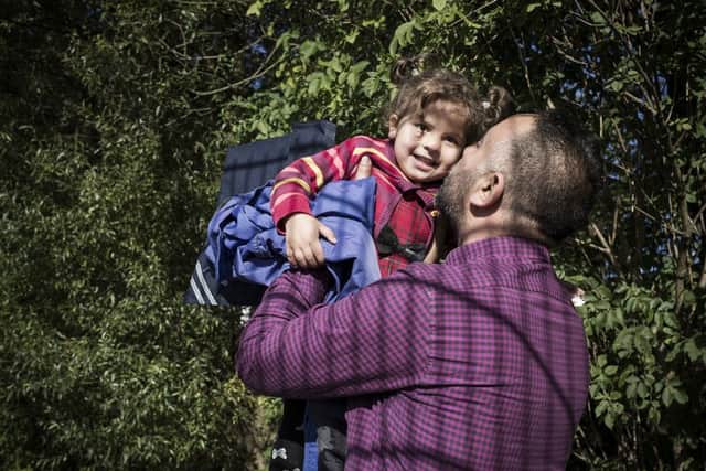 Mohammad greeting his daughter. Picture: Conor Ashleigh/British Red Cross/PA
