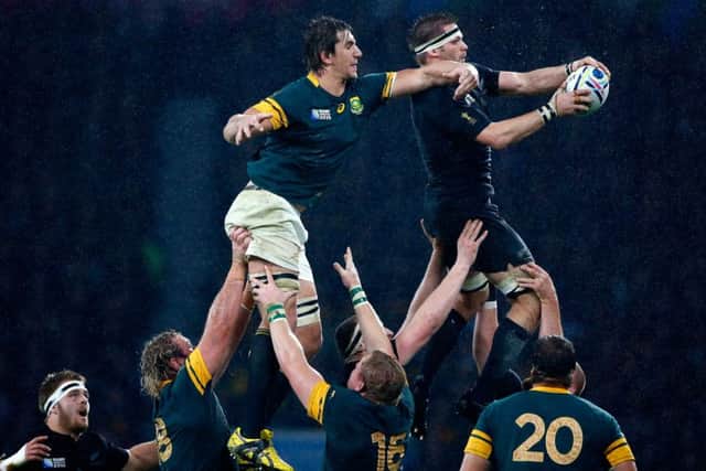 All Blacks captain Richie McCaw wins  line-out ball from Eben Etzebeth of South Africa during the World Cup semi final at Twickenham. Picture: Getty
