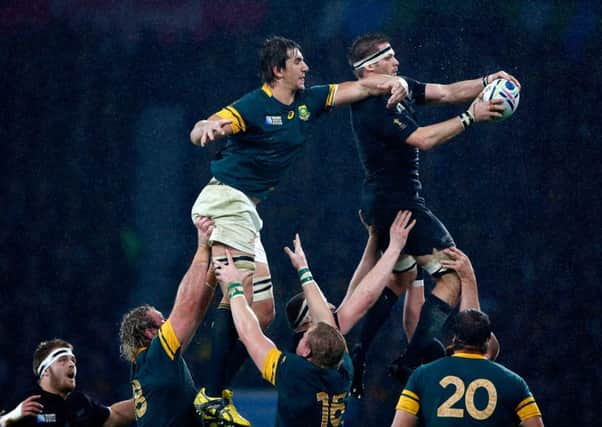 All Blacks captain Richie McCaw wins  line-out ball from Eben Etzebeth of South Africa during the World Cup semi final at Twickenham. Picture: Getty