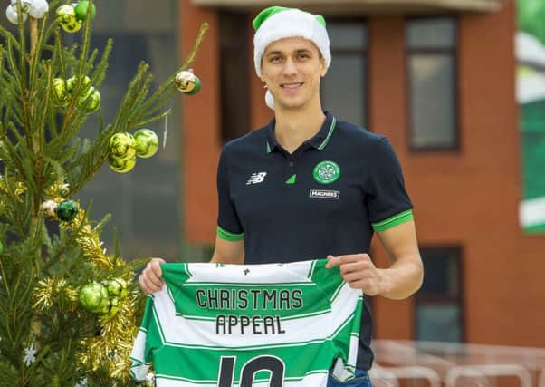 Celtic defender Jozo Simunovic helps to launch this year's Celtic FC Foundation Christmas Appeal. Picture: SNS