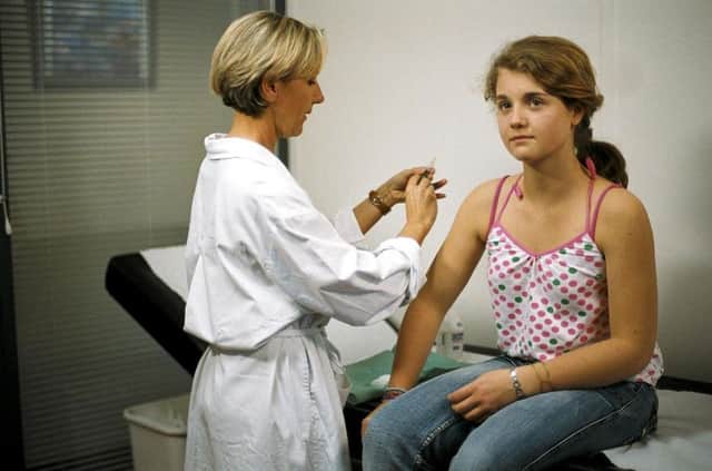 Young girls are offered the HPV vaccine to protect them from cervical cancer. Picture: PA