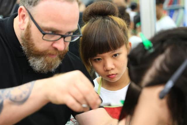 The Medusa hair salon owner helped train young people in Vietnam