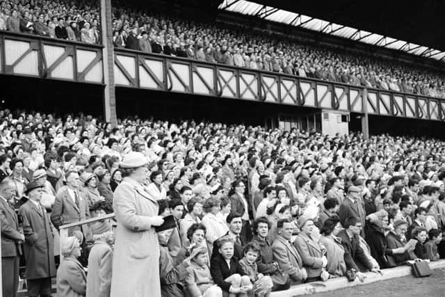 Members of the public listen to a speech by Christian evangelist Billy Graham at Ibrox in 1961. Picture: TSPL