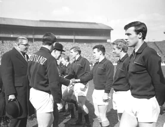 Glasgow Lord Provost John Johnston shakes hands with the Scotland team before a game against England in April 1966. Picture: TSPL