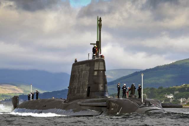 Pictured is HMS Ambush, one of Britain's nuclear-powered submarines, returning to HMNB Clyde on the Clyde estuary.