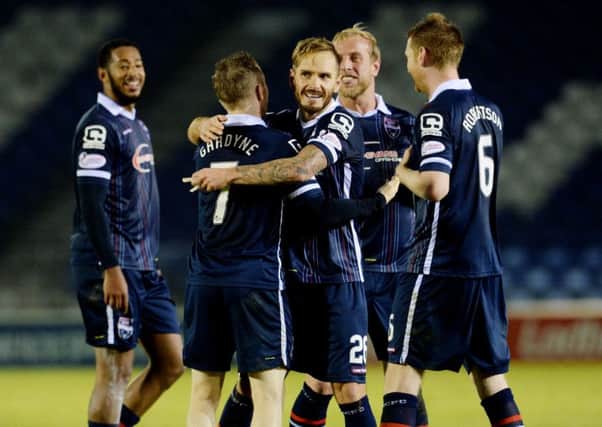 Ross Countys Martin Woods, centre, celebrates his sides win with goalscorer Michael Gardyne. Picture: SNS Group