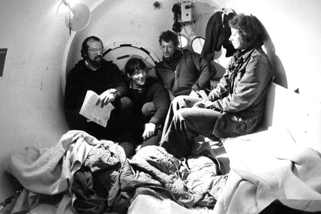 Four people inside the decompression chamber for divers at Faslane naval base on the Clyde in May 1976.