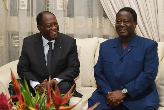 Alassane Ouattara, left, with ally Konan Bedie Henri. Picture: AFP/Getty