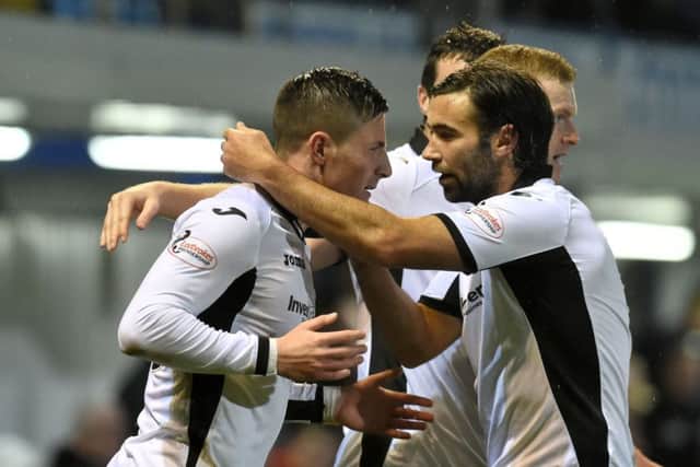St Johnstone's Michael O'Halloran (left) celebrates having put his side 2-1 ahead. Picture: SNS