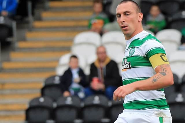 Scott Brown limped out of the warm-up with a knee injury. Picture: Gordon Fraser