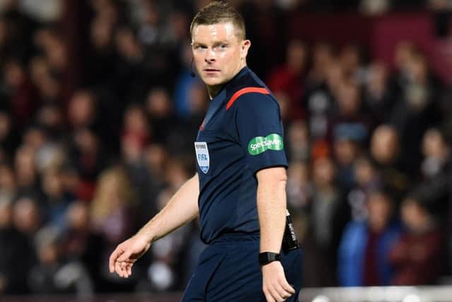 Referee John Beaton drew heavy criticism from the home support for not showing a second yellow card to Nir Bitton. Picture: SNS
