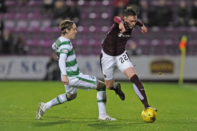 Stefan Johansen and Jordan McGhee battle for possession during the League Cup quarter-final. Picture: Neil Hanna
