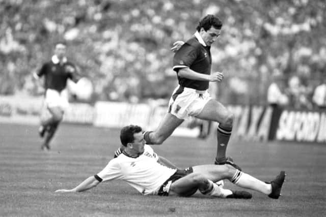 Paul McStay side-steps England's Chris Waddle during a 1989 international at Wembley. Picture: Stephen Mansfield