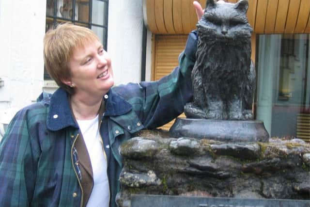 Cats Protection Chief Executive Helen Ralston with a bronze casting of Towser.