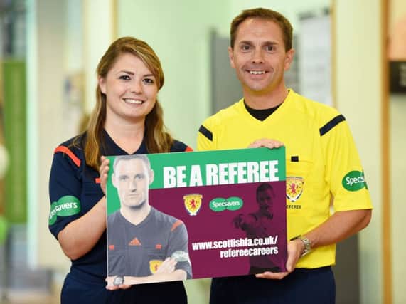 Category one referee Crawford Allan and his daughter Vikki promote referee recruitment. Picture: SNS