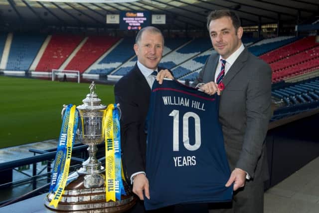 Stewart Regan (left) and William Hill's chief marketing officer Alex O'Shaughnessy announce a sponsorship renewal at Hampden Park. Picture: SNS