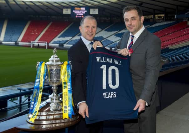Stewart Regan (left) and William Hill's chief marketing officer Alex O'Shaughnessy announce a sponsorship renewal at Hampden Park. Picture: SNS