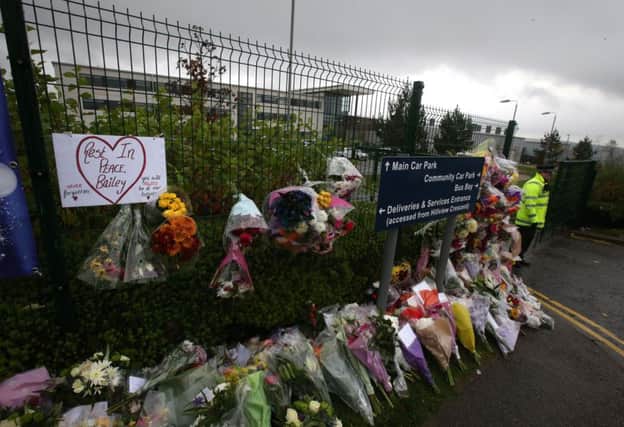 Flowers left outside Cults Academy in Aberdeen where 16 year old Bailey Gwynne died after being stabbed. Picture: PA