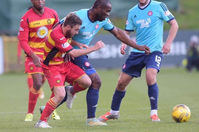 Christian Nade, centre, credits the Hamilton fitness coach with improving his game. Picture: SNS