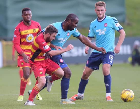 Christian Nade, centre, credits the Hamilton fitness coach with improving his game. Picture: SNS