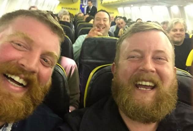 Neil Thomas Douglas on the right, sitting next to doppelganger Robert Stirling. Picture: Twitter/LeeBeattie