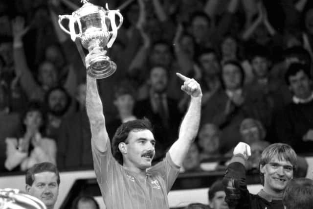 Aberdeen captain Willie Miller holds up the trophy after the Aberdeen v Celtic Scottish Cup final in 1984. Picture: Donald MacLeod