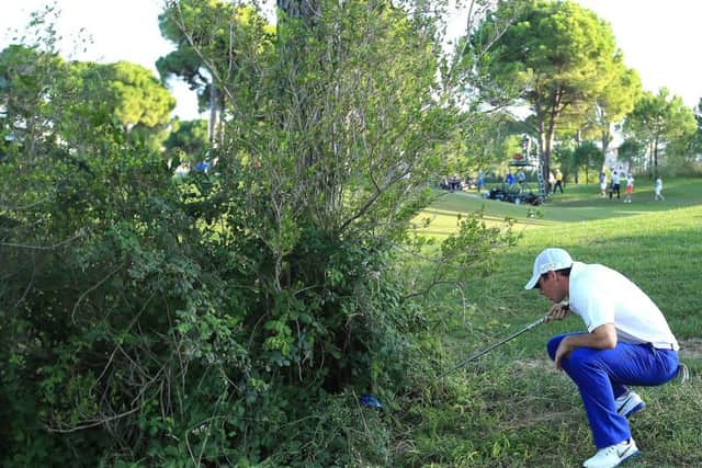 Rory McIlroy finds himself in trouble at the 18th, but he still managed to save par. Picture: Getty