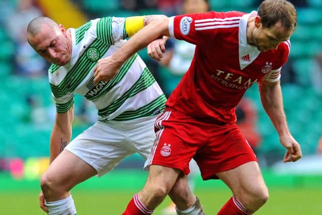 Celtic and Aberdeen do battle in the early kick-off at Celtic Park. Picture: Robert Perry