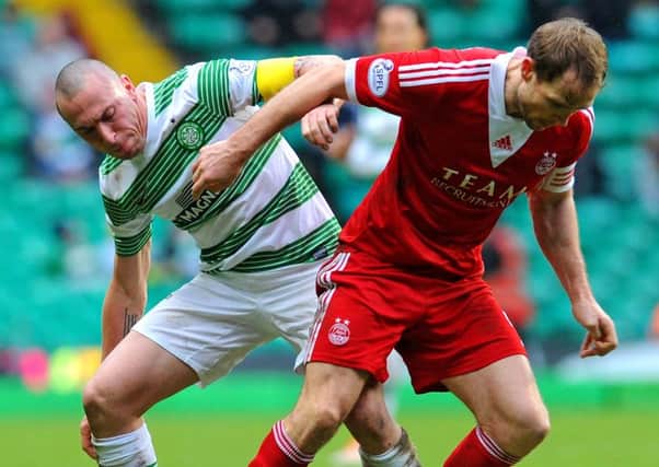 Celtic and Aberdeen do battle in the early kick-off at Celtic Park. Picture: Robert Perry