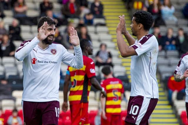 Hearts' Juanma Delgado, left, celebrates with Osman Sow having scored his second of the match to put his side 3-0 ahead. Picture: SNS