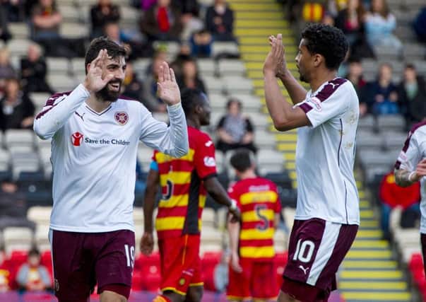 Hearts' Juanma Delgado, left, celebrates with Osman Sow having scored his second of the match to put his side 3-0 ahead. Picture: SNS