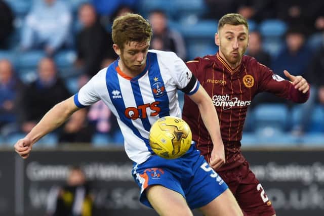 Kilmarnock's Stuart Findlay (left) battles with Motherwell's Louis Moult. Picture: SNS