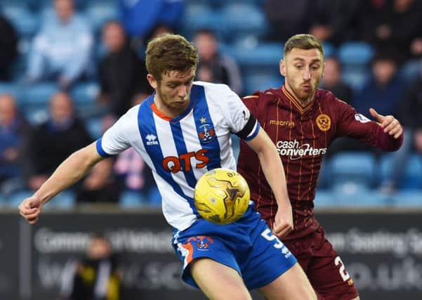 Kilmarnock's Stuart Findlay (left) battles with Motherwell's Louis Moult. Picture: SNS