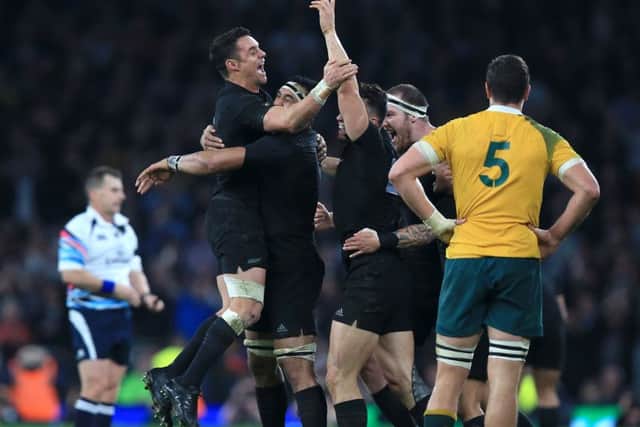 New Zealand's Daniel Carter (left) celebrates with teammates after the Rugby World Cup Final. Picture: PA