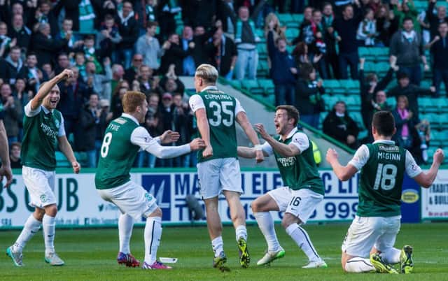 The Hibs players celebrate after taking the lead through Jason Cummings. Picture: Ian Georgeson