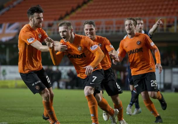 Billy Mckay celebrates after scoring his 81st-minute penalty. Picture: SNS