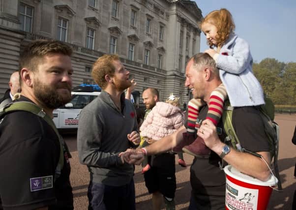 Prince Harry meets with members of the Walking With The Wounded team at Buckingham Palace. Picture: Getty