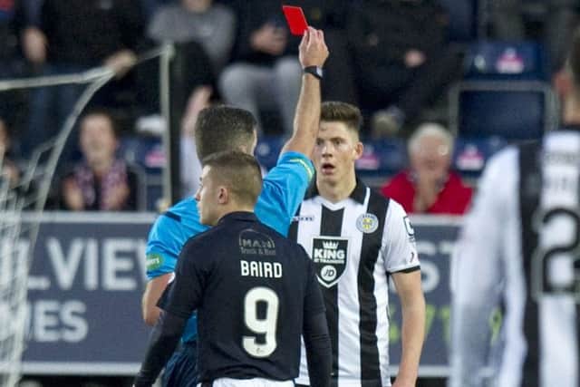 Jack Baird is rather harshly sent off for deliberate handball. Picture: SNS
