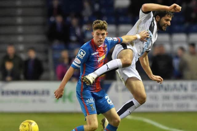 Ryan Christie won a penalty after a tussle with Kevin Holt. Picture: SNS