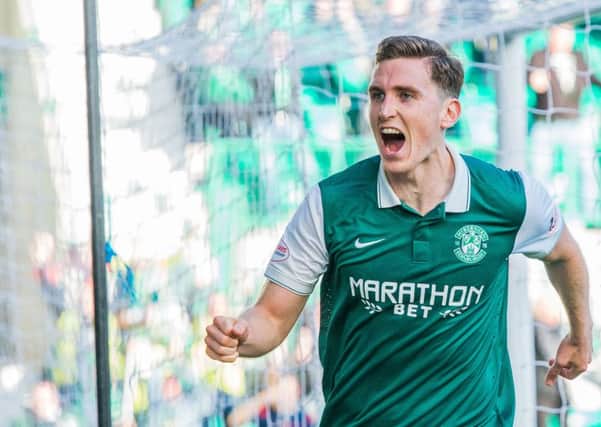 Paul Hanlon wheels away after powering a header past Wes Foderingham to hand Hibs victory over Rangers. Picture: Ian Georgeson