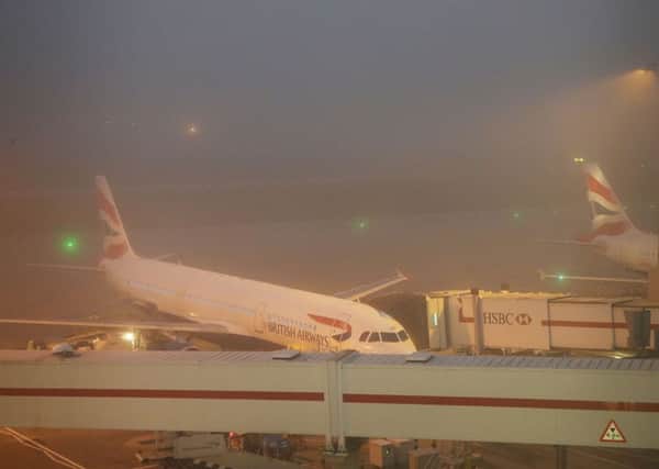 Aeroplanes sit on the apron at Heathrow. A number of flights have been delayed or cancelled due to fog. Picture: PA