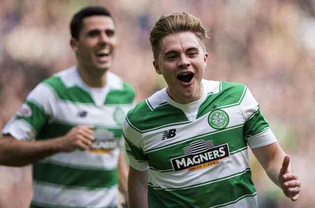 James Forrest celebrates after netting Celtic's third. Picture: PA