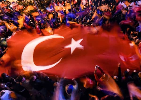 Supporters of Turkeys AKP celebrate in Istanbul after their partys stunning electoral success. Picture: AFP/Getty Images