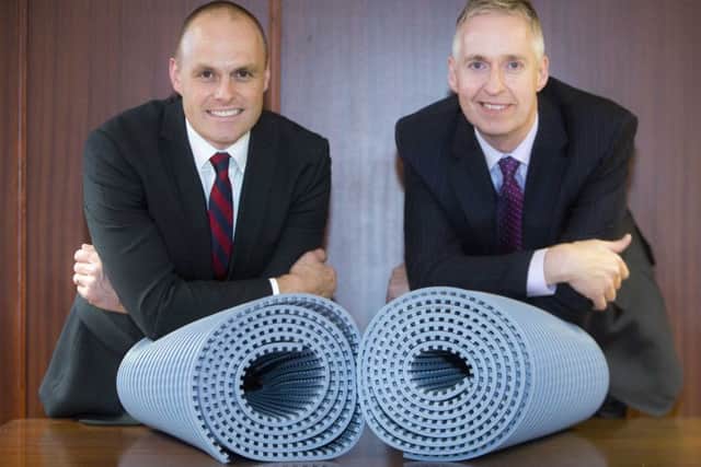 Bank of Scotland's Craig McSporran, left, with Weatherproofing Advisors finance director Colin Henderson. Picture: Peter Devlin