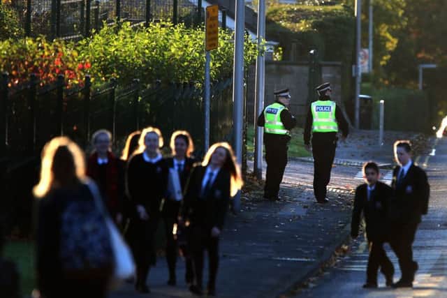 Police outside Cults Academy in Aberdeen as pupils return to classes . Picture: PA