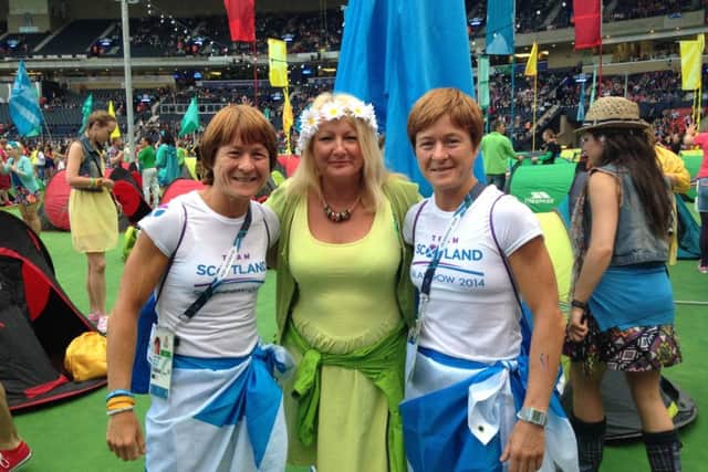 Helen at the Commonwealth Games with judo medal winning twins Fiona and Donna Robertson