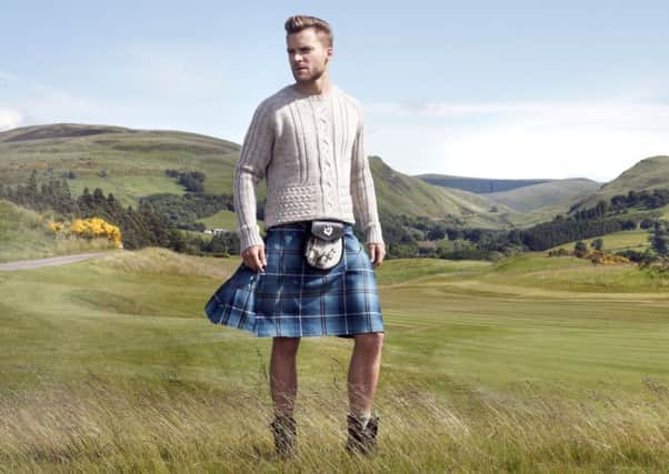 Model wearing a kilt made from the Ryder Cup Tartan.